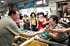 President Yoon Suk Yeol, left, chats with merchants at a traditional market in Geoje, South Gyeongsang, on Aug. 4, 2023, during his summer vacation. [PRESIDENTIAL OFFICE]