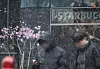 Snow falls over azaleas blooming in Jongno District, central Seoul, on March 30. [YONHAP]