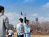 A game of rock-paper-scissors decides which team wins possession first. [GENF]