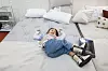 A child lies on a bed during the Seoul Living Design Fair at Coex in Gangnam District, southern Seoul, on Feb. 26. [YONHAP]