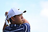 Tom Kim, also known as Kim Joo-hyung, watches his ball on the range prior to the FedEx St. Jude Championship at TPC Southwind on in Memphis on Aug. 8.  [PGA TOUR]