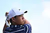 Tom Kim, also known as Kim Joo-hyung, watches his ball on the range prior to the FedEx St. Jude Championship at TPC Southwind on in Memphis on Aug. 8. [PGA TOUR]