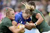 France's Joanna Grisez, center, is tackled by South Africa's Eloise Webb and Jakkie Cilliers during the Women's Rugby World Cup 2025 Pool D match between France and South Africa in Northampton, England, Sept. 7. [AP/YONHAP]