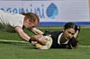 New Zealand's Braxton Sorensen-McGee, right, scores a try as Ireland's Niamh O'Dowd tries to defend during the Women's Rugby World Cup 2025 Pool C match between New Zealand and Ireland in Brighton and Hove, England, Sept. 7, 2025. [AP/YONHAP]