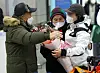 Kim Young-mi, right, greets her parents after arriving at Incheon International Terminal on Jan. 25. [YONHAP]