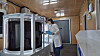 A Pulmuone researcher examines seaweed in a tank where it is farmed. [PULMUONE]