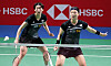 Lee So-hee. left, and Shin Seung-chan in action during the women's doubles final match against Chen Qing Chen and Jia Yi Fan of China at the BWF Badminton World Championships in Huelva, Spain on Sunday. [EPA/YONHAP]