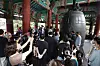Parents ring the bell Tuesday at the Bosingak Pavilion in Jongno District, central Seoul, to pray for students to do well on the national College Scholastic Ability Test (CSAT), 100 days before the exam.[YONHAP]