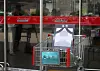 A shopping cart is placed in front of Costco Korea's Gwangmyeong headquarters in Gyeonggi on Aug. 2 as a tribute to a Costco employee who, due to working in scorching heat, had passed away while organizing shopping carts. [NEWS1]