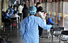 A health worker sprays disinfectants at a Covid-19 testing center in Songpa District, western Seoul, on Tuesday. [NEWS1]