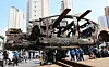 The burnt Mercedes EQE sedan is transferred for investigation in Incheon. [YONHAP]
