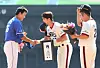 Former Doosan Bears stars Oh Jae-won, center, and Yoo Hee-kwan, right, present gifts to Lee Seung-yuop during a retirement ceremony at Jamsil Baseball Stadium in Seoul on Sept. 3, 2017. [YONHAP]