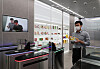 A model tries out an automatic payment system at a 7-Eleven convenience store in Geumcheon District, southern Seoul, on Tuesday. At the store, which the company calls a digital transformation store, a total of 26 high performance cameras are set up to analyze which products customers pick up from which shelf. Various systems are tested at this store before they are applied to other convenience stores. [YONHAP]