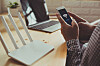 Closeup of a wifi router, smartphone and laptop [SHUTTERSTOCK]