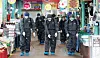 Health care workers spray disinfectant Tuesday at a traditional market in Incheon. [YONHAP]