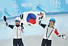 Chung Jae-won, left, and Lee Seung-hoon celebrate after medaling in the men's mass start at the 2022 Beijing Olympics on Saturday. [YONHAP]