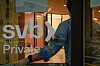 An employee holds the door open at the Silicon Valley Bank branch office in downtown San Francisco, California, on Monday. [REUTERS]