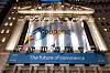 Flags raised ahead of Coupang’s initial public offering in front of the New York Stock Exchange building on Thursday. [JOONGANG ILBO]