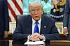 U.S. President Donald Trump speaks with reporters as he signs executive orders and proclamations in the Oval Office of the White House in Washington on May 5. [AP/YONHAP]