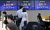 Screens in Hana Bank's trading room in central Seoul show foreign and stock markets close on Tuesday. [YONHAP]