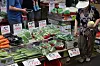 A customer shops for groceries at a vegetable stall at Mangwon Market in Mapo District, western Seoul, on Sunday. Grocery prices are on the rise following recent heavy rainfalls and heatwaves, with the price of spinach soaring nearly 130 percent in July compared to the previous month and lettuce 72 percent. Cucumber prices rose 67 percent from the previous week. [YONHAP]