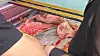 A customer in his 60s buys dog meat from a retailer in Gyeongdong Market, Dongdaemun District, eastern Seoul, on Monday. [JOONGANG ILBO]