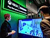 A Samsung Electronics employee plays a game using the company's smart TV and gaming monitor in the Gaming Hub experience zone at the Microsoft Experience Center (MEC) in London. The center is a gaming hub jointly opened by Samsung Electronics and Microsoft. Another center is also located in New York City. [YONHAP]
