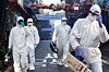 Officials from the Yongsan District Office disinfect streets in Itaewon, central Seoul, on Thursday ahead of Halloween in efforts to prevent new infections of Covid-19. [NEWS1]