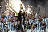 Argentina's Lionel Messi lifts the trophy after winning the World Cup in Qatar on Sunday. [AP/YONHAP]
