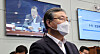 Senior Presidential Secretary for Civil Affairs Shin Hyun-soo listens to President Moon Jae-in's remarks during the senior secretariat meeting at the Blue House on Monday. [YONHAP]