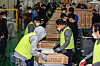 Workers sort boxes of test sheets for this year’s College Scholastic Ability Test (CSAT) at a printing plant in Sejong on Monday, three days ahead of the yearly exam. [YONHAP]