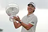 Min Woo Lee celebrates with the trophy after winning the Texas Children's Houston Open at Memorial Park Golf Course in Houston, Texas on March 30. [GETTY IMAGES]