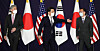 Noh Kyu-duk, South Korea’s special representative for Korean Peninsula peace and security affairs, center, reaches out to Takehiro Funakoshi, Japan’s director-general for Asian and Oceanian affairs, right, while taking a photo with Sung Kim, the U.S. special representative for North Korea, left, ahead of trilateral talks at the Lotte Hotel in central Seoul Monday. [JOINT PRESS CORPS]