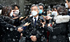 Rep. Choe Kang-wook, chairman of the Openminjoo Party, center, leaves the Seoul Central District Court on Thursday after the court convicted him of issuing false internship certificates to help former Justice Minister Cho Kuk's son apply to graduate schools. [NEWS1]