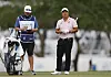 Lee Kyoung-hoon, right, and caddie Darren Woolard prepare to tee off from the fifth tee during the final round of The Cognizant Classic in The Palm Beaches at PGA National Resort And Spa on Sunday in Palm Beach Gardens, Florida. [GETTY IMAGES]