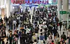 Duty-free area at Incheon Airport Terminal 1 is crowded by passengers on Oct. 3, the first day of Chuseok holiday period. [NEWS1]
