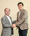 Coupang founder Kim Bom-suk, right, and Masayoshi Son, at SoftBank headquarters in Tokyo in 2018. [JOONGANG ILBO]
