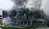 Coupang’s Deokpyeong Logistics Center in Icheon, Gyeonggi, continues to burn on Friday. The fire, which broke out Thursday morning, continued through Friday and could take days to fully extinguish. [YONHAP]