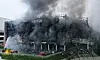 Coupang’s Deokpyeong Logistics Center in Icheon, Gyeonggi, continues to burn on Friday. The fire, which broke out Thursday morning, continued through Friday and could take days to fully extinguish. [YONHAP]
