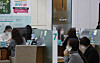 People talk to bank tellers at a Hana Bank branch in central Seoul on Oct. 31. [YONHAP]