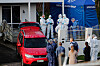 New Zealand police in Auckland on Aug. 11, 2022, after the bodies of two children were discovered in suitcases. [AP]