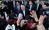 President Yoon Suk Yeol greets supporters upon arriving at his official residence in Yongsan District, central Seoul, on March 8. [YONHAP]