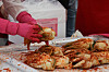 A participant makes kimchi at an event in Yeouido Park in western Seoul on Tuesday. [YONHAP]