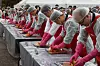 Participants make kimchi at an event in Yeouido Park in western Seoul on Tuesday. [YONHAP]