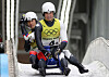 Korean lugers Park Jin-yong and Cho Jung-myung compete their race in the luge team relay during the Beijing 2022 Winter Olympic Games, at the Yanqing National Sliding Centre on Thursday. [YONHAP]