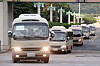 Buses carrying members of the Cheonghae unit leave an air base in Seongnam, Gyeonggi, on July 20. A total of 272 out of the 301-member unit on an anti-piracy mission off East Africa have tested positive for Covid-19. [NEWS1]