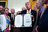 U.S. President Donald Trump displays his signed bill during a signing ceremony for The Halt All Lethal Trafficking of Fentanyl Act in the East Room of the White House in Washington on July 16. [EPA/YONHAP]
