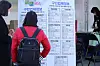 A woman looking at a board listing companies offering jobs during a job fair exclusive targeting at women, who had to stop their careers due to marriage, childbirth or raising a family, held at Daegu on Nov. 9. [NEWS1]