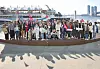 Members of the diplomatic corps representing some 40 countries pose at the sea next to the Jagalchi Seafood Market in Busan on Saturday. [PARK SANG-MOON]