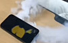 In this video, taken and uploaded by a friend of the pictured iPhone's owner, the phone is seen letting out large amounts of smoke inside a classroom at a high school in Cheonan, South Chungcheong, on Thursday. [SCREEN CAPTURE]
